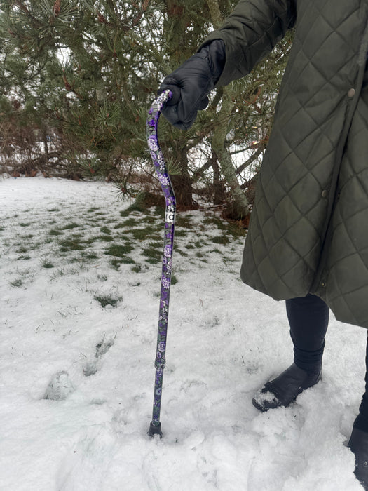 Ora kävelykeppi taivutetulla kädensijalla (violetti kukka)