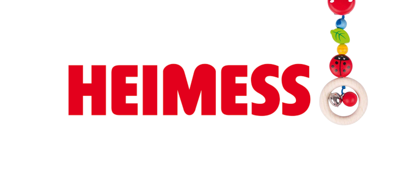 Heimessin Saksassa valmistetut puiset tuttinauhat ja vaunulelut. Kuvassa Heimessin logo. 