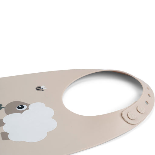 Done by Deer Sheepy ruokalappu beige kiinnitysmekanismi