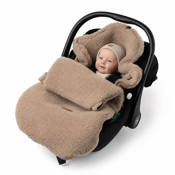 Zaffiron beige Nevada lämpöpussi kaukalossa vauvalla